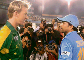 Sachin Tendulkar congratulates Bret Lee after India made its exit from the ICC Champions Trophy in Mohali on Sunday. 