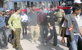 Some spectators detained by the police come out of the Phase VIII police station in Mohali on Sunday.