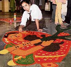 A student makes a rangoli showing a mother kill her daughter at DAV School, Sector 8, in Panchkula, on Monday.