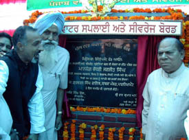 Choudhary Jagjit Singh, Minister for Local Bodies, Labour and Employment, after laying the foundation stone for a water supply and sewerage scheme at Old Grain Market in Jagraon on Monday