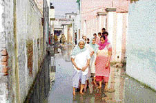 Streets of Jugiana village filled with dirty water