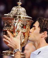 Swiss Roger Federer kisses his trophy after beating Chiles Fernando Gonzales in the final of the Swiss Indoors ATP tennis tournament in Basel 