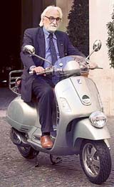 Italy's Transport Minister Alessandro Bianchi rides a new model of Piaggio's Vespa scooter at the Chigi palace in downtown Rome 