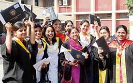 PAU students show their degrees after the convocation in Ludhiana on Tuesday