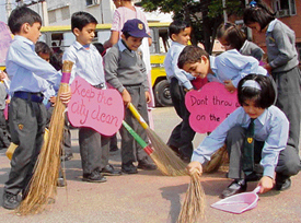 Tiny tots of Dikshant International School take part in a cleanliness drive on the occasion of Haryana Day in Panchkula on Wednesday.