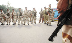 Enforcing Discipline: ITBP personnel deployed at Vikas Marg after the outbreak of violence on the third and last day of Delhi bandh called by traders to protest against the sealing drive.