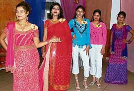 Participants get ready to walk on the ramp during a Miss Freshers party held by Primary Teacher Training students in Ludhiana on Tuesday. 