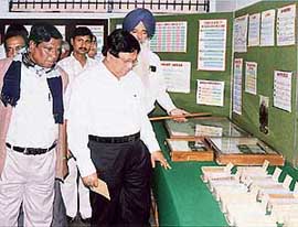 Dr Mortoza Hossain, leader of a delegation from West Bengal, being shown high-yielding varieties at Crop Museum of Punjab Agricultural University in Ludhiana on Wednesday. 