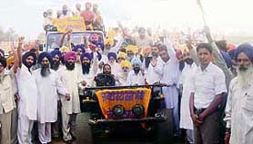 Mr Jagdish Singh Garcha, Kilaraipur MLA, leads a jatha of SAD workers near Ahmedgarh on Wednesday.