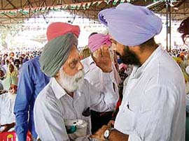PPCC general secretary Raninder Singh gives a patient hearing to an elderly man during a public rally in Goniana Mandi on Wednesday.