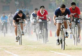 Students of PEC take part in the 4,800 m cycle race during their annual athletics meet at their college
