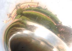 Mirror Image: A distorted view of North Block is reflected on the surface of a trumpet being played by a member of the Naval Band performing at South Block.