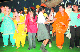 Students of Sollentuna International School, Sweden, and Police DAV Public School dance together in Jalandhar on Wednesday evening.