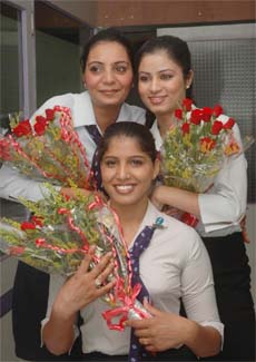 Three students of the Frankfinn Institute of Air Hostess Training are all cheers after they got jobs with airlines companies in Jalandhar