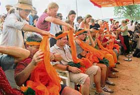 Tourists participate in the Turban tying competition at Pushkar Mela, Asia's largest cattle fair, in Pushkar on Thursday.