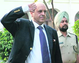 Mr Naveen Chawla, Election Commissioner of India, takes salute at a passing-out parade in Amritsar on Thursday.