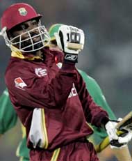 West Indies opener Chris Gayle celebrates on completing his century