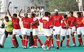 Members of the Delhi team celebrate after beating the Namdharis in the semifinal of the National Hockey Championship at the Olympian Surjit Hockey Stadium