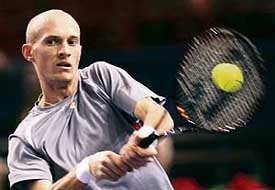 Russias Nikolay Davydenko returns the ball to compatriot Dmitry Tursunov during their match in the Paris Masters tennis tournament on Thursday