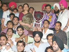 Students of APJ College of Fine Arts, Jalandhar, with their Principal after winning the overall trophy in "A" Division of the Zonal Youth Festival for Men on the regional campus of GND University in Jalandhar
