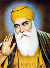 This pose has been a particularly popular one in recent years. Features to be noted include the venerable white beard, lidded eyes, hand raised in blessing, halo, saffron robe