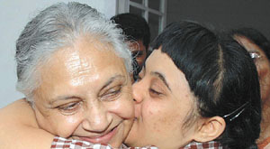 Delhi Chief Minister Sheila Dikshit getting a hug during an interaction with children with special needs based in Bangalore. 