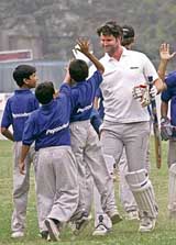 New Zealand player Chris Cairns with fans after an exhibition match in Kolkata