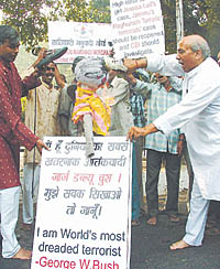 Activists of the Krantikari Manuwadi Morcha and supporters of Saddam Hussain vent their ire on an effigy of US President George Bush at Jantar Mantar in the Capital on Wednesday. 