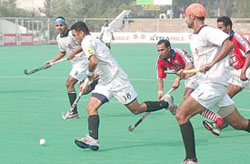 IOC captain Deepak Thakur in action against BSF during the 23rd Indian Oil Surjit Hockey Tournament at the Olympian Surjit Hockey Stadium in Jalandhar on Wednesday. 