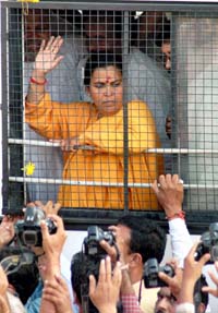 Bharatiya Jan Shakti president Uma Bharati in police custody in Bhopal on Thursday after she courted arrest against the alleged false cases against her