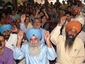 Members of the Punjab State Ministerial Services Union protest in front of the Deputy Commissioners office, Jalandhar, on Thursday, demanding revision of pay scales.