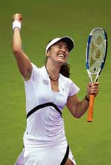 Switzerlands Martina Hingis exults after beating Russias Nadia Petrova in a match at the WTA tour championship in Madrid on Wednesday