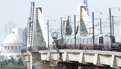 Easing Chaos: A Metro train sails through the heart of the Capital.