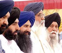 Capt Kanwaljit Singh and Mr Parkash Singh Badal, SAD general secretary and President, respectively, (from right) at a rally in Fatehpur Garhi village, near Rajpura, on Satuday.