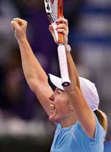 Belgiums Justine Henin-Hardenne celebrates after beating Russias Maria Sharapova in the seminfinal of the WTA Tour Championships in Madrid on Saturday.