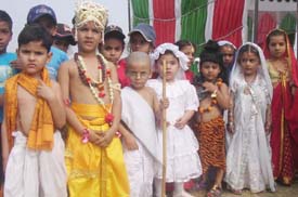 Students of Anand Isher School Chhapar, near Ahmedgarh, pose after a fancy dress function to mark the Childrens Day