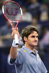 Switzerlands Roger Federer celebrates his win over Argentinas David Nalbandian during the opening match of the Masters Cup tennis tournament in Shanghai on Sunday