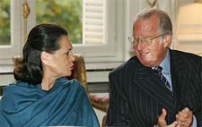 Congress President Sonia Gandhi speaks with Belgium King Albert at Laeken Castle during a lunch with members of the royal family in Brussels on Sunday.