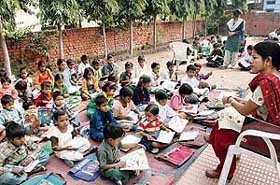 Children being taught in the open at the Rotary House, Sector 12-A, Panchkula, on Monday. 