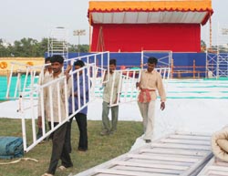 Workers prepare a pandal for a Swami Ram Devs yoga camp in Amritsar 