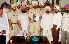 Mr Rachhpal Singh Hara, DSP, Malerkotla, inaugurates circulation of Darpan, monthly journal of the Police Department, at Bhogiwal, near Ahmedgarh, on Monday.