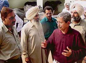 Dr Arun Purshottam Phatak interacts with Mr Hardev Singh, a dairy farmer, at Padiala village