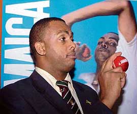 Courtney Walsh gestures during a press conference in New Delhi on Monday.