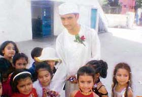 Students of Shishu Niketan Model Senior Secondary School, Sector 22-D, Chandigarh, take gifts from Chacha Nehru on Childrens Day