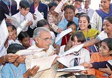 Children vie with each other to get their certificates autographed by the Chief Minister, Mr Bhupinder Singh Hooda, at a special function held to honour them at the CM residence in Sector 3, Chandigarh, on Tuesday.