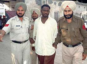 David, a South African national, in police custody in a cyber fraud case