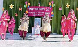 Students of Green Land School perform a dance