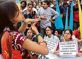 A girl gives instructions to members of the Disabled Rights Group taking part in a protest demanding filling of vacant government posts reserved for the physically challenged, at the Ministry of Social Justice and Empowerment, Shastri Bhavan