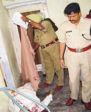 Muktsar SSP G. Nageshwar Rao and other police officials inspect the crime scene in Malout on Wednesday.