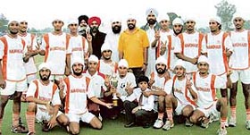 The Namdhari Academy of Bhaini Sahib with the 5th All-India Jagtar Singh Memorial Hockey trophy at PAU, Ludhiana on Friday.